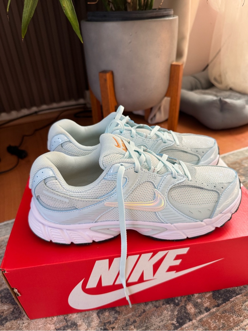 Nike Women's Pastel Blue Mesh Walking Sneakers with Iridescent Swoosh